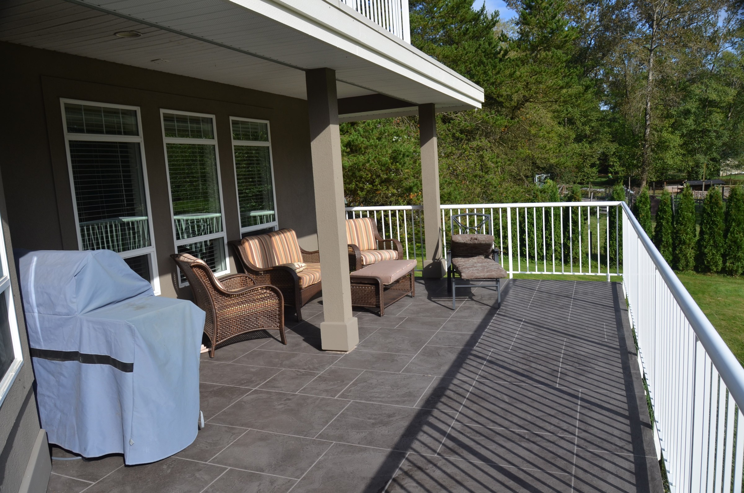 Covered deck with StoneCraft waterproofing system over wood substrate
